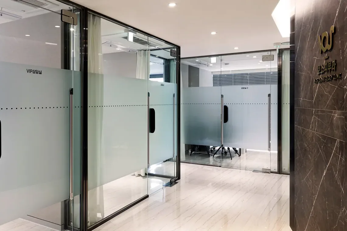 Private treatment room corridor at VOS Dermatology Clinic